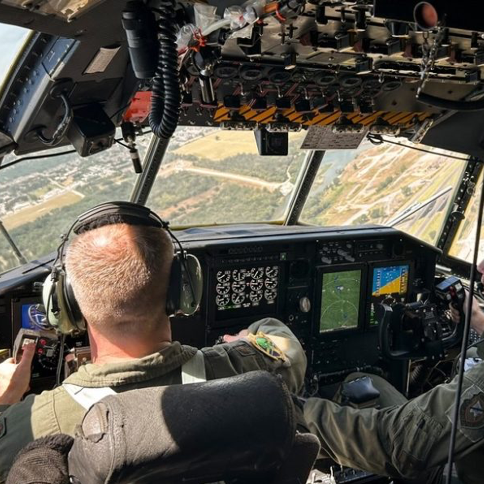 Pilot and co-pilot in military aircraft cockpit